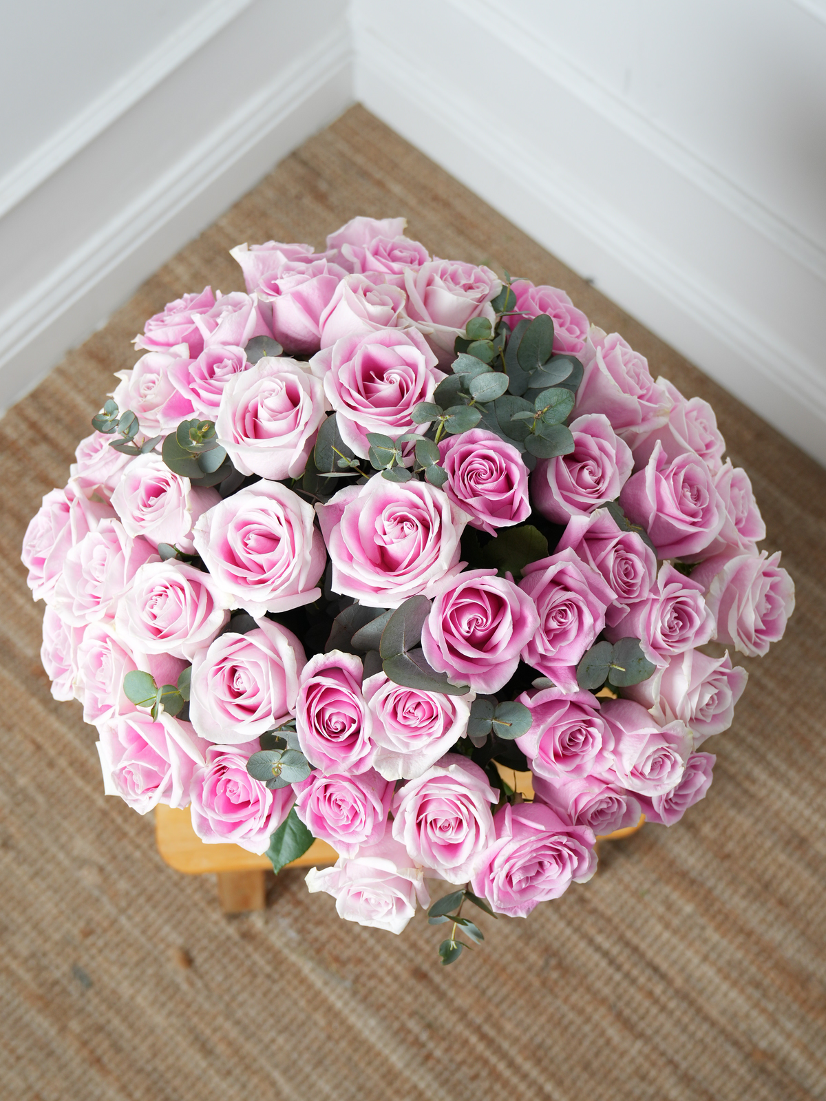 50 Pink Roses in a vase
