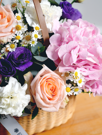 Sweet Pastel Basket – Brighten up any space with our 'Sweet Pastel' arrangement, featuring soft pink hydrangeas, peach...