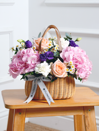 Sweet Pastel Basket – Brighten up any space with our 'Sweet Pastel' arrangement, featuring soft pink hydrangeas, peach...