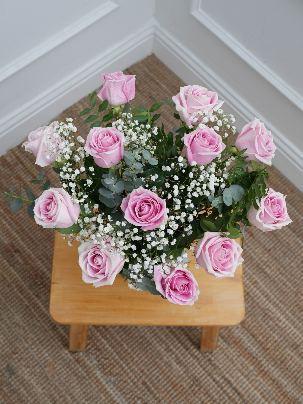 12 Pink roses with a vase