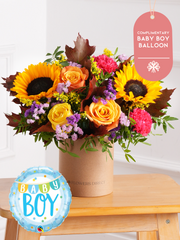 Baby Boy Autumn Charm - Hatbox (Complimentary Baby Boy Balloon) – The Baby Boy Colour Burst - Hatbox is a vibrant and joyous floral arrangement...