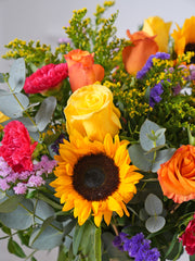 Colour Burst Vase – Brighten up any room with our "Colour Burst" arrangement, featuring stunning sunflowers, cerise carnations,...