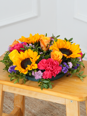 Colour Burst Wreath – This Colour Burst Funeral Wreath weaves together the vibrant hues of orange and yellow Roses,...
