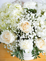Sympathy Pure Bliss - Hatbox with Free Sympathy card –  Indulge in the pure and serene beauty of our "Pure Bliss" arrangement, featuring pristine...