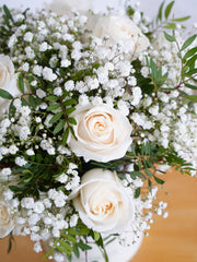 White Roses Hatbox – Celebrate any special occasion with our stunning 12 white roses hatbox, elegantly complemented by gypsophillia and...