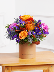 Crisp Meadow Hatbox – The Crisp Meadow Hatbox is an affordable seasonal delight, filled with vibrant orange roses,...