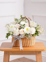 Sympathy Simply White Basket – A charming all-white basket of roses, carnations, chrysanthemums, and gypsophilia with pistach greenery and...
