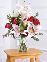 Red Roses and Pink Lily Vase – This is a very elegant bouquet, featuring large headed Naomi Red roses with scented...