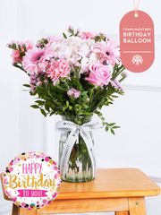 Birthday Sweetheart - Vase (Complimentary Birthday Balloon) – Express your love and affection with our "Sweetheart" arrangement, featuring delicate pink hydrangeas, vibrant...