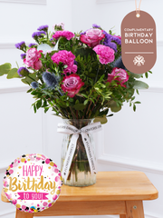 Birthday Purple Majesty - Vase (Complimentary Birthday Balloon) –  Experience the regal and majestic beauty of our "Purple Majesty" arrangement, featuring luxurious deep...