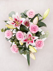 Sympathy Pink Roses and Pink Lily in a vase – A serene display of pink roses and pink lilies, artfully arranged in a glass...