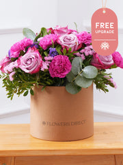 Purple Majesty Hatbox Free Upgrade – Experience the regal and majestic beauty of our "Purple Majesty" arrangement, featuring luxurious deep...