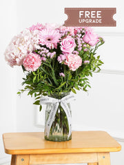 Sweetheart Vase Free Upgrade –  Express your love and affection with our "Sweetheart" arrangement, featuring delicate pink hydrangeas, vibrant...