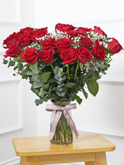 24 Red Roses With a vase – Indulge in the timeless elegance of 24 Long Stem Red Roses gracefully arranged in...