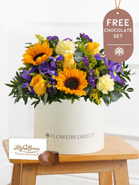 Iris Bliss - Hatbox with Free Chocolate Set – Bright and full of charm, Iris Bliss is a vibrant hatbox arrangement for any...