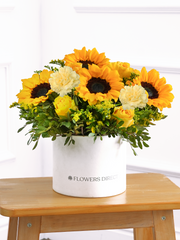 Sunflower Hatbox – Give the gift of pure joy with this vibrant Sunny Day Hatbox floral arrangement! The golden...