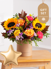 Autumn Charm Hatbox Gift Set – Embrace the season with our Autumn Charm hatbox, featuring yellow and orange roses, cerise...