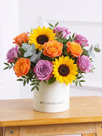 Sunflower Hatbox – Give the gift of pure joy with this vibrant Sunny Day Hatbox floral arrangement! The golden...