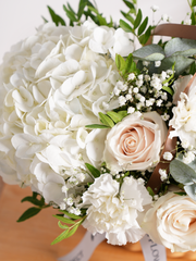 Sympathy Pure Bliss Basket – A graceful composition of white roses, carnations, and hydrangeas, artfully arranged in a rustic...