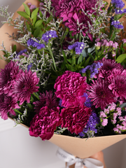 Purple Bunch! – Elevate any moment with this gorgeous mix of Purple Statice, Pink Statice, Carnations, and...