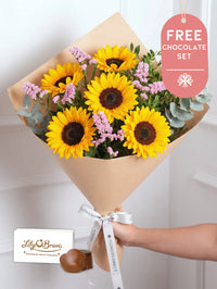 Pink Glow Bunch! with Free Chocolate Set – Brighten any day with this warm mix of sunflowers and delicate pink statice. Paired...