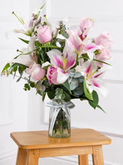 Pink Roses and Pink Lily Vase – This is a very elegant bouquet, featuring large-headed pink roses and scented pink oriental...