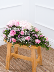 Sweetheart Spray – Offering solace through delicate blooms, the dainty "Sweetheart" arrangement features hydrangea, pink roses, statice, carnations,...