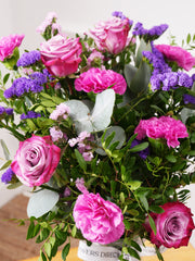 Sympathy Purple Majesty - Vase –  Elegance and serenity intertwine in Lavender Purple Majesty, a captivating arrangement showcased in a...