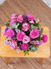Purple Majesty Hatbox Free Upgrade – Experience the regal and majestic beauty of our "Purple Majesty" arrangement, featuring luxurious deep...