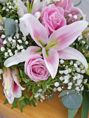 Pink Roses and Pink Lily Spray – This captivating funeral wreath gracefully combines the delicate beauty of pink roses and pink...