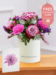 Purple Majesty Hatbox with Free Occasion Card – Experience the regal and majestic beauty of our "Purple Majesty" arrangement, featuring luxurious deep...