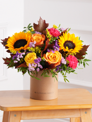 Autumn Charm Hatbox – Embrace the season with our Autumn Charm hatbox, featuring yellow and orange roses, cerise...