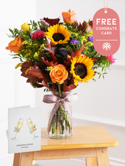 Autumn Charm - Vase with Free Congratulations Card – Brighten up any room with our "Autumn Charm - Vase" arrangement, featuring stunning sunflowers,...