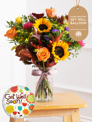 Autumn Charm - Vase with Free Get Well Balloon –  Brighten up any room with our "Autumn Charm - Vase" arrangement, featuring stunning sunflowers,...
