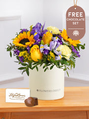 Iris Bliss - Hatbox with Free Chocolate Set – Bright and full of charm, Iris Bliss is a vibrant hatbox arrangement for any...