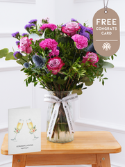 Purple Majesty - Vase with Free Congratulations Card –  Experience the regal and majestic beauty of our "Purple Majesty" arrangement, featuring luxurious deep...