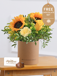 Thank You Sunny Flower - Hatbox with Free Chocolate Set – Give the gift of pure joy with this vibrant Sunny Day Hatbox floral arrangement! The golden...