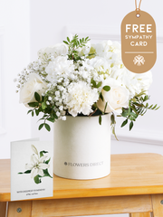Sympathy Pure Bliss - Hatbox with Free Sympathy card –  Indulge in the pure and serene beauty of our "Pure Bliss" arrangement, featuring pristine...