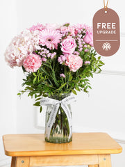 Sweetheart Vase Free Upgrade –  Express your love and affection with our "Sweetheart" arrangement, featuring delicate pink hydrangeas, vibrant...