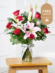 Red Roses and Pink Lily Vase Free Upgrade – This is a very elegant bouquet, featuring 6 large headed Naomi Red roses with...