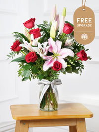 Red Roses and Pink Lily Vase Free Upgrade – This is a very elegant bouquet, featuring 6 large headed Naomi Red roses with...