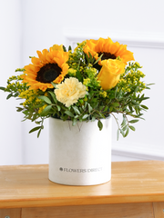Sunflower Hatbox – Give the gift of pure joy with this vibrant Sunny Day Hatbox floral arrangement! The golden...