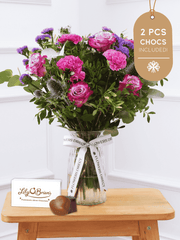 Purple Majesty Vase 2 Pcs Chocs included! – Experience the regal and majestic beauty of our "Purple Majesty" arrangement, featuring luxurious deep...