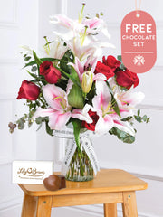 Anniversary Red Roses and Pink Lily - Vase with Chocolate Set –  This is a very elegant Anniversary bouquet, featuring large headed Naomi Red roses with...