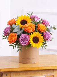 Sunflower Hatbox – Give the gift of pure joy with this vibrant Sunny Day Hatbox floral arrangement! The golden...