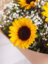 Sunflower Charm Bunch! with Free Chocolate Set – Golden sunflowers and soft white gypsophila come together in this timeless hand-tie. Finished with...