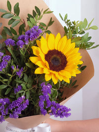 Sunset Purple Bunch! with Free Chocolate Set – Sunset shades of gold and purple come together in this eye-catching mix of sunflowers...