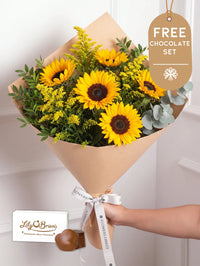 Sunshine Bunch! with Free Chocolate Set – Send a little sunshine with this cheerful arrangement of sunflowers and feathery yellow solidago....