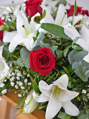 Red Roses and White Lily Spray – This funeral wreath, adorned with graceful red roses, elegant white lilies, delicate gypsophila, accompanied...