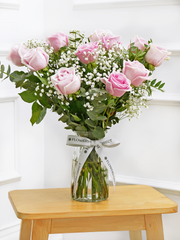 12 Pink roses with a vase – Elevate the essence of romance with our exquisite bouquet of 12 Long Stem Pink...